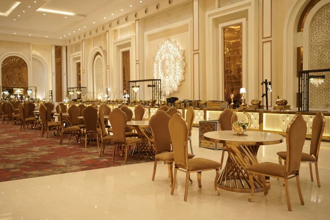 Luxurious banquet hall with ornate decor and elegant seating set for a formal event